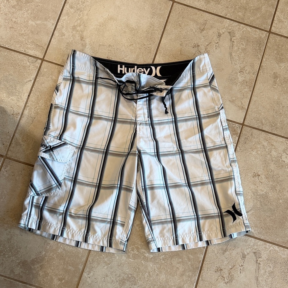 Men’s white with black & turquoise board shorts.